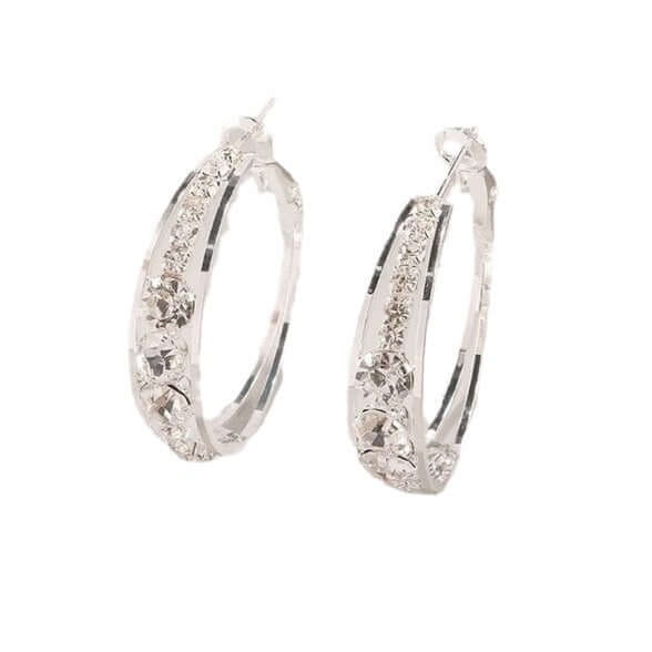 Elegant silver hoop earrings featuring intricate crystal embellishments, perfect for women's fashionable styles.