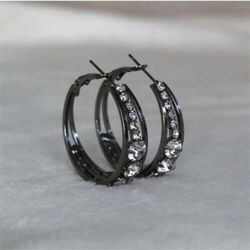 Elegant black hoop earrings adorned with sparkling crystals, perfect for adding a touch of sophistication.