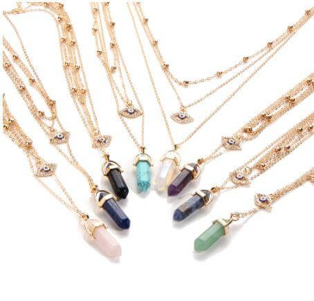 All Seeing Eye multilayer necklace featuring natural stone pendants, Amethyst and Opal, in gold chains.